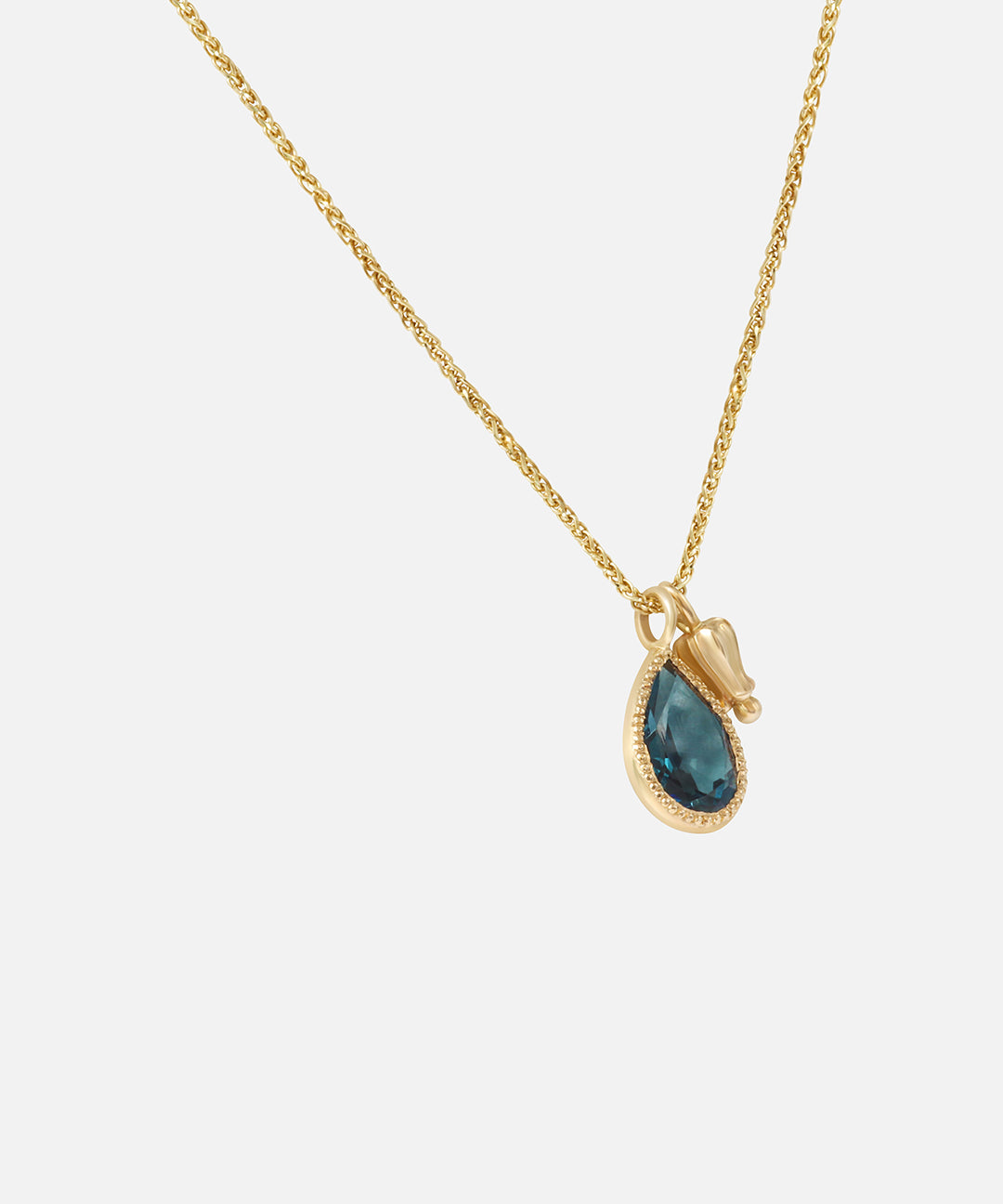 Side view of Little Mirror and Topaz Pendant