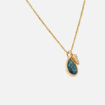 Side view of Little Mirror and Topaz Pendant