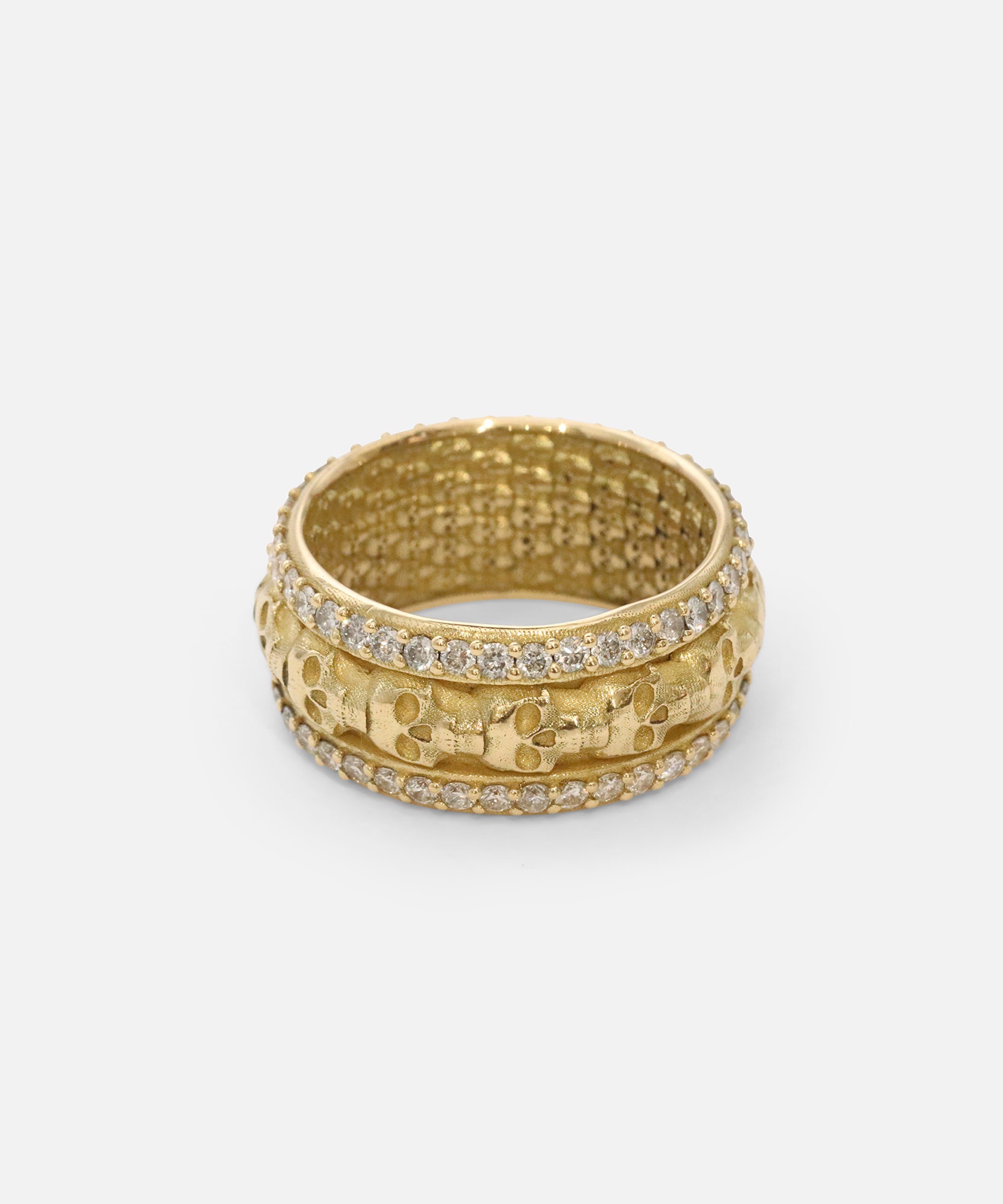 Angled front view of Skulls In A Line Band / Pave White Diamonds showcasing out details by Fitzgerald Jewelry