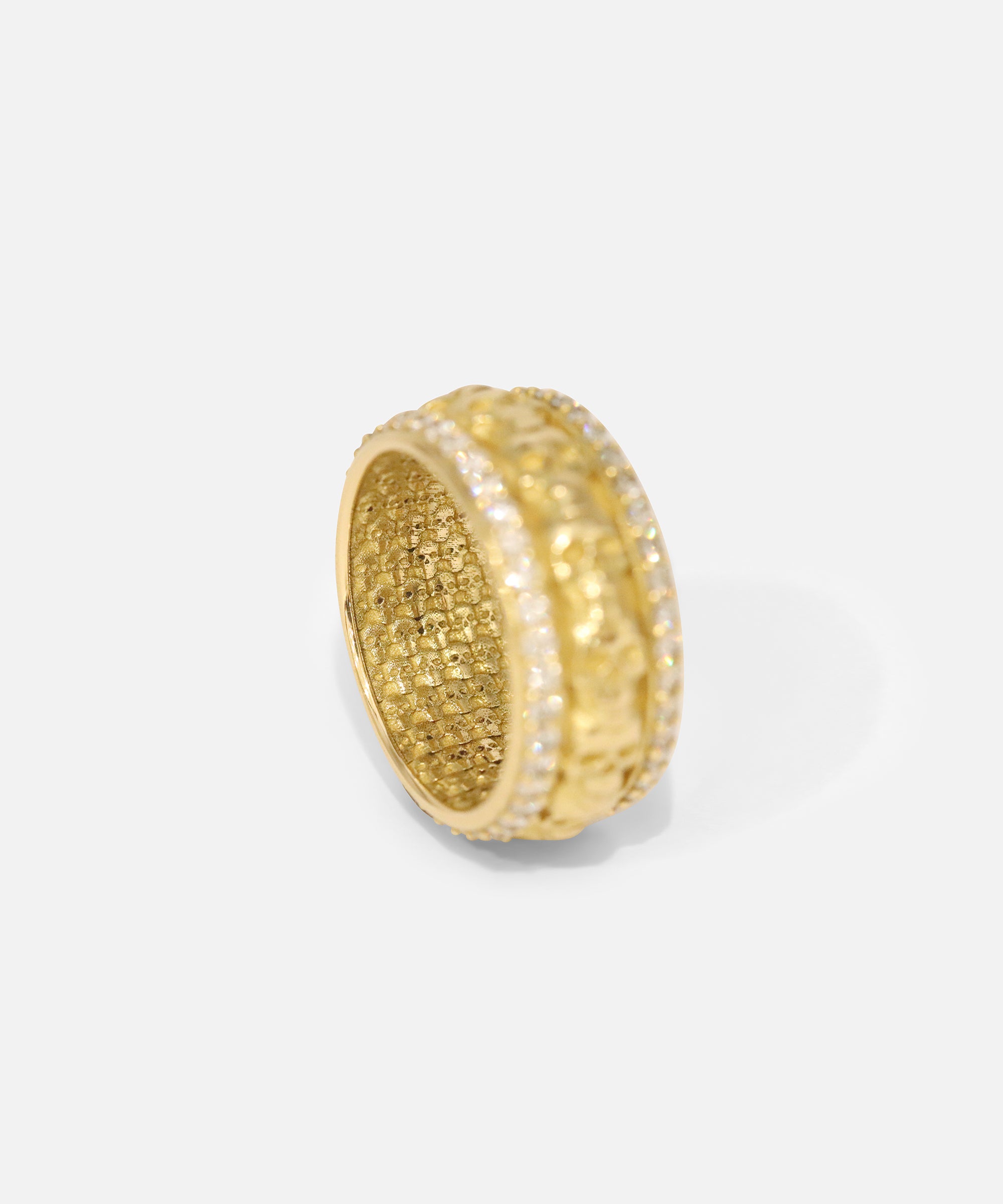 Angled ertical view of Skulls In A Line Band / Pave White Diamonds showcasing inner engravings by Fitzgerald Jewelry