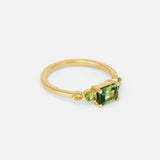 Angled side view of Uma / Emerald Cut Sapphire Ring by Casual Seannce