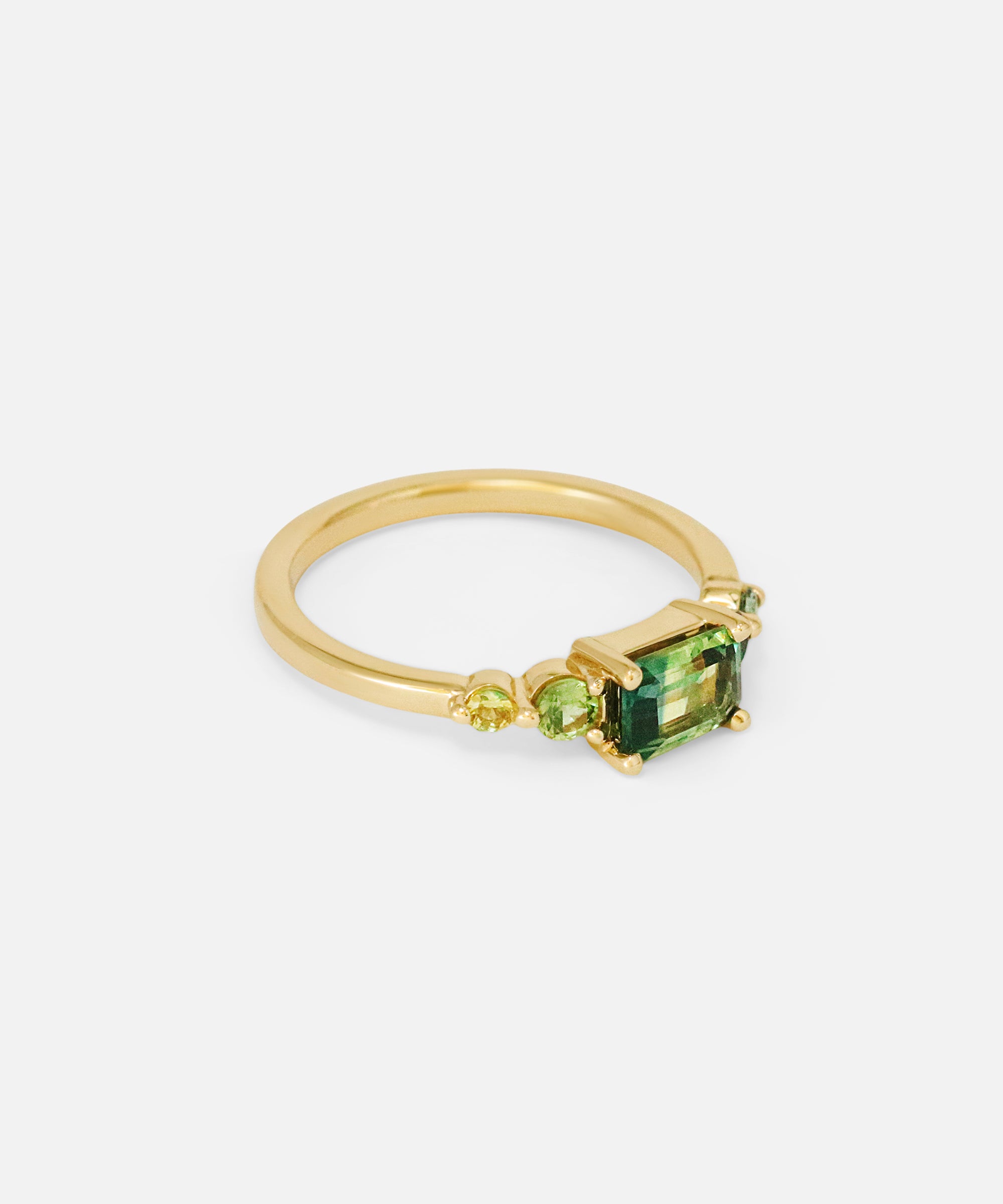 Angled side view of Uma / Emerald Cut Sapphire Ring by Casual Seannce