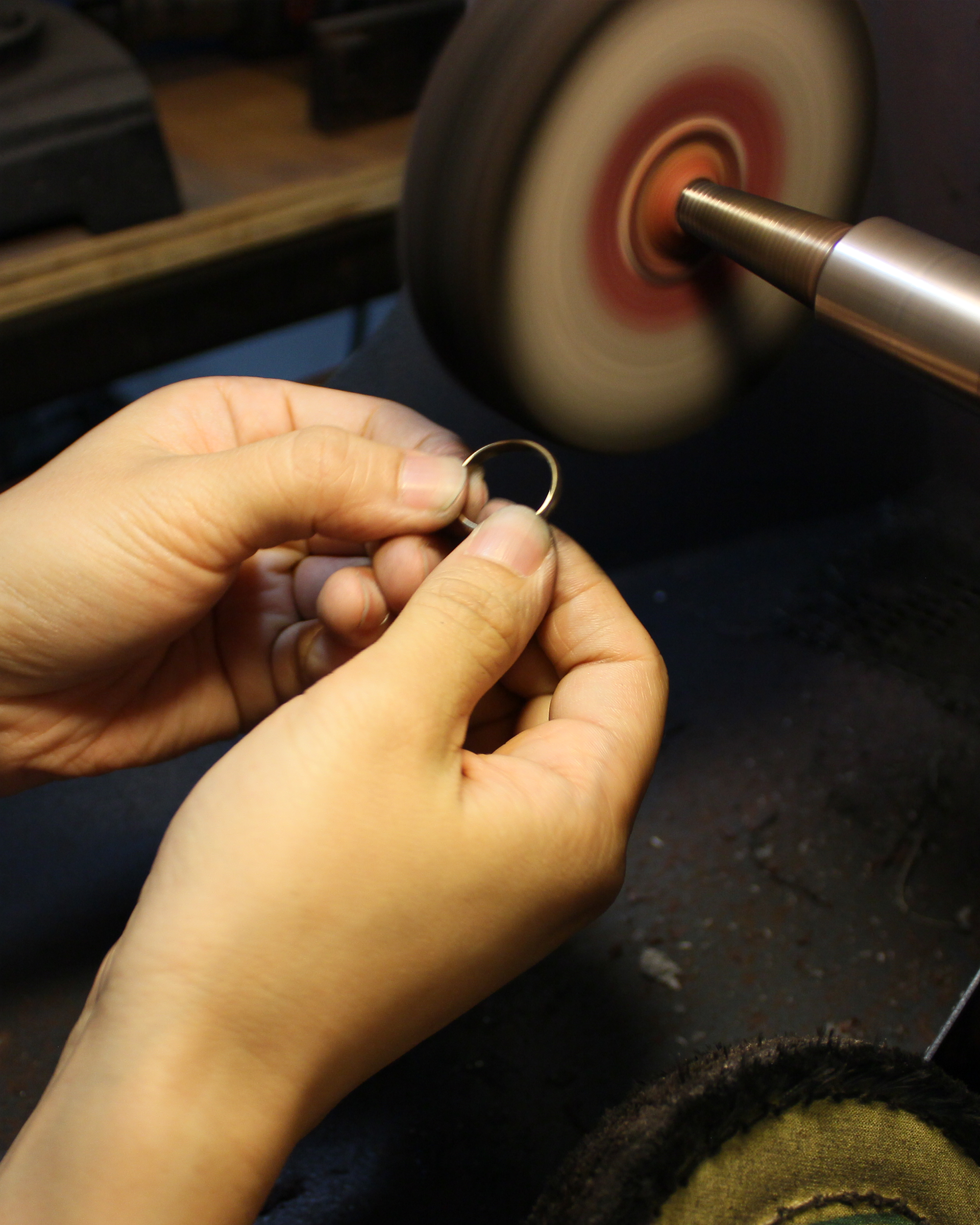 Student using our sanding wheel to finish off a piece during a private workshop.