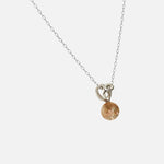 Side view of Reflections Pendant / Brown Sunstone by Young Sun Song in 14k white gold