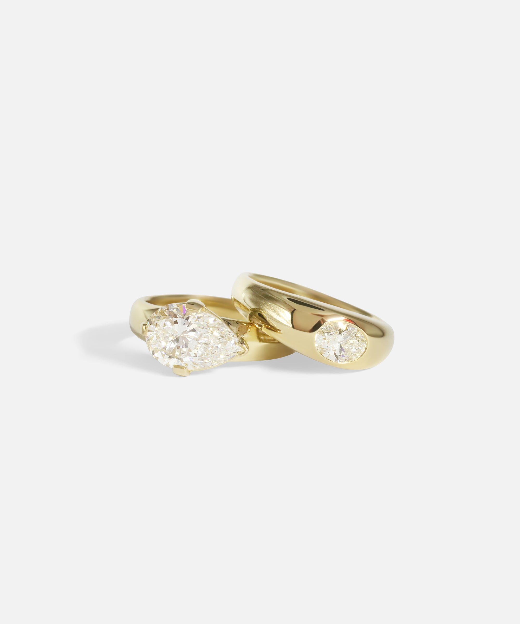 Group front facing shot Optic Oval Signet Ring / Diamond in 14k yellow gold and Comet Ring / Lab Pear Diamond in 14k yellow gold by Joko