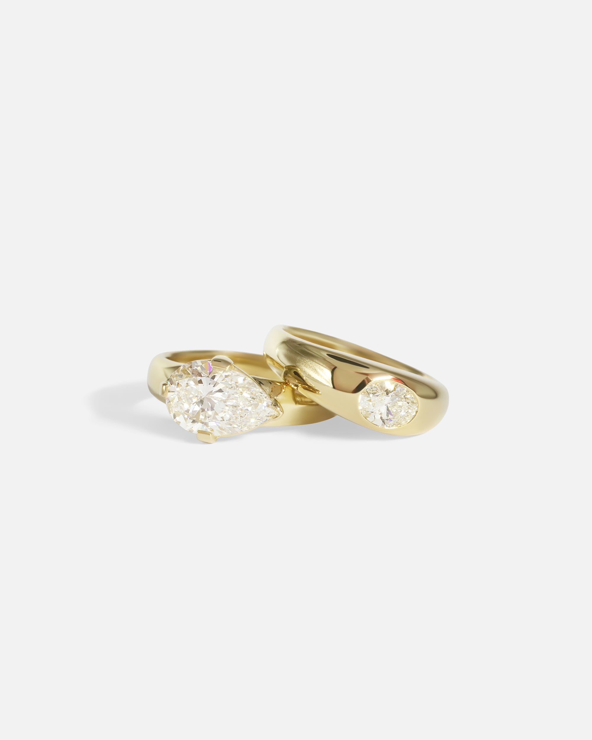 Group front facing shot Optic Oval Signet Ring / Diamond in 14k yellow gold and Comet Ring / Lab Pear Diamond in 14k yellow gold by Joko