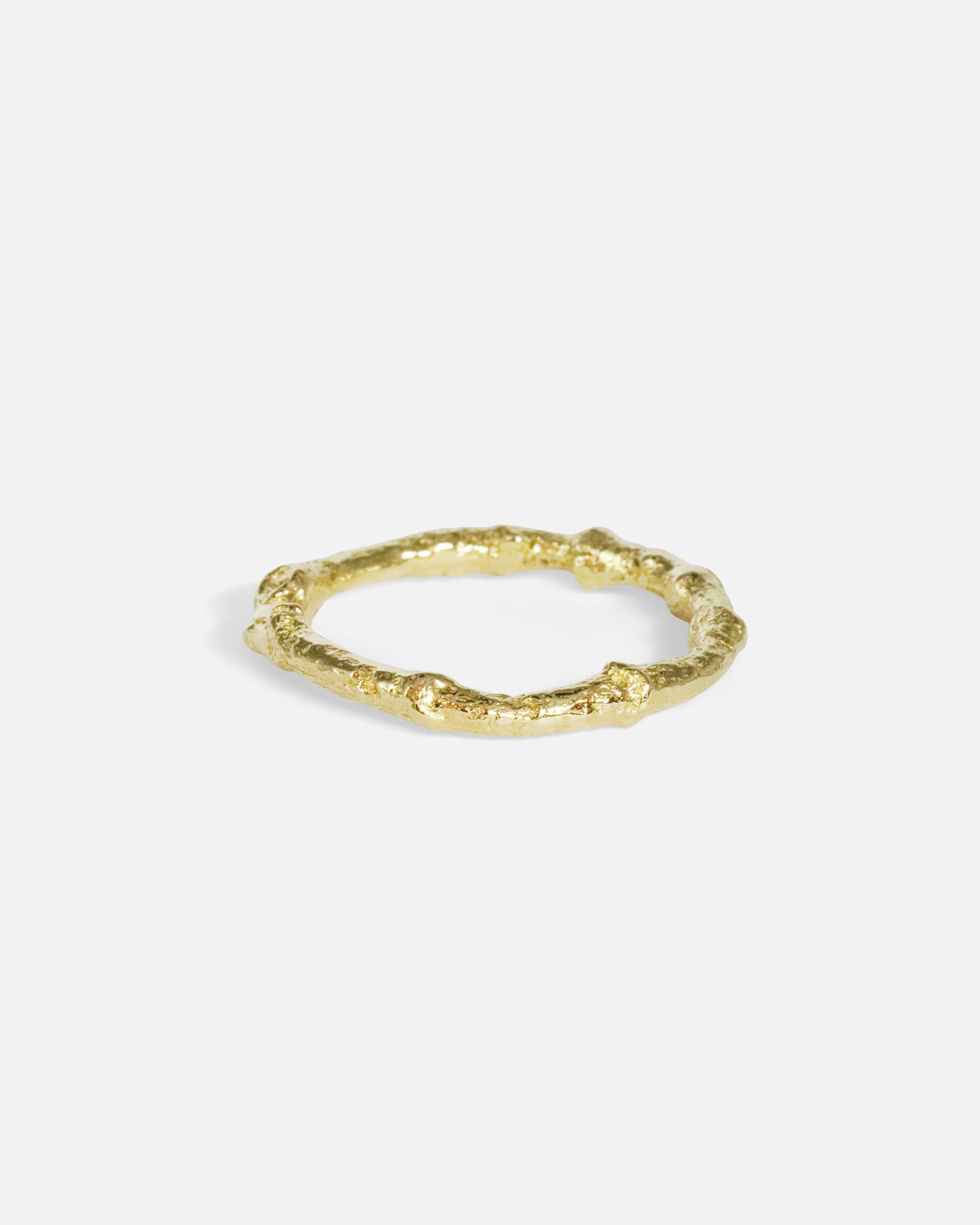 Side view of Bone Tree Band / Large in 14k yellow gold by Ides