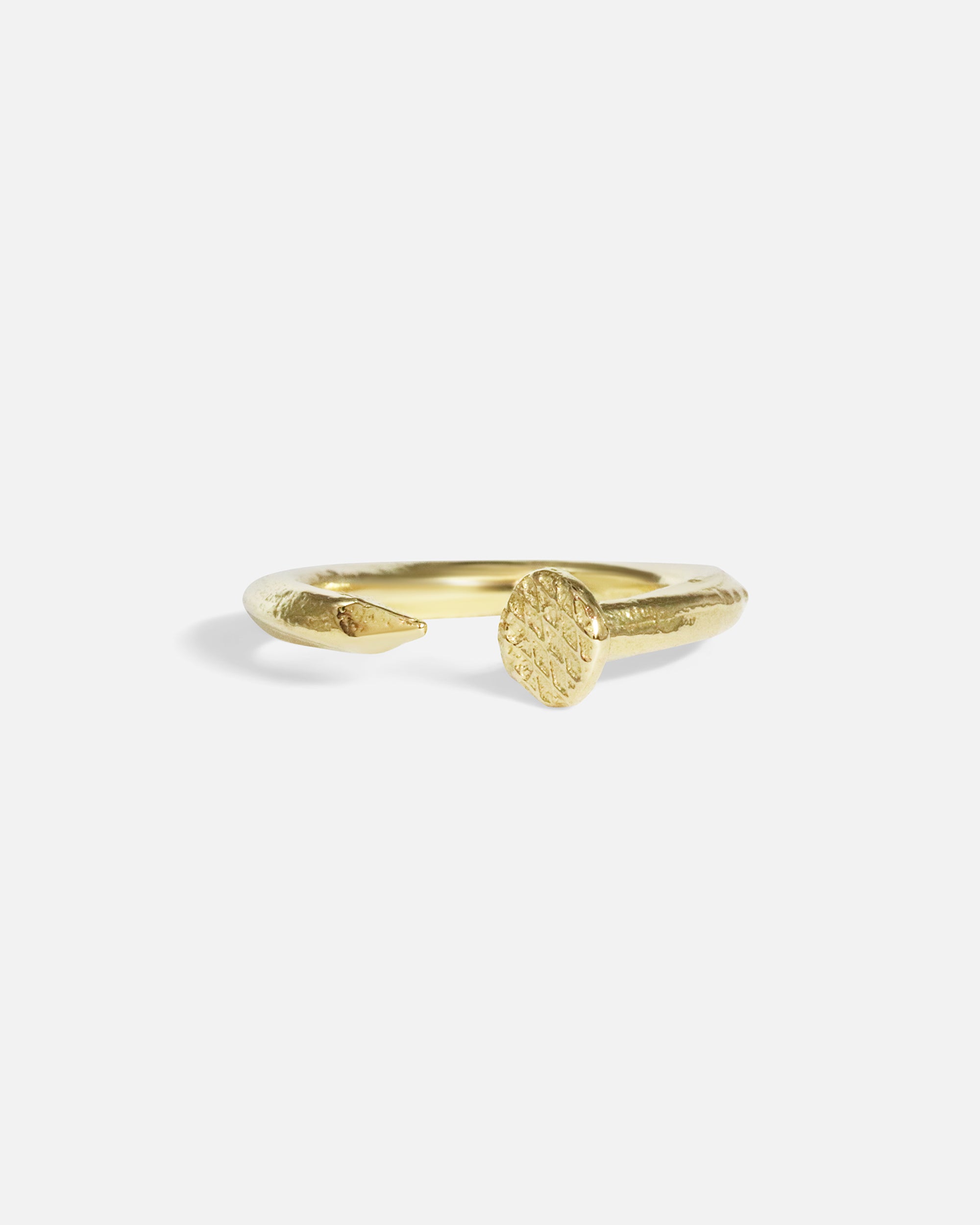Front view of Twisted Nail Ring in 14k yellow gold by Ides