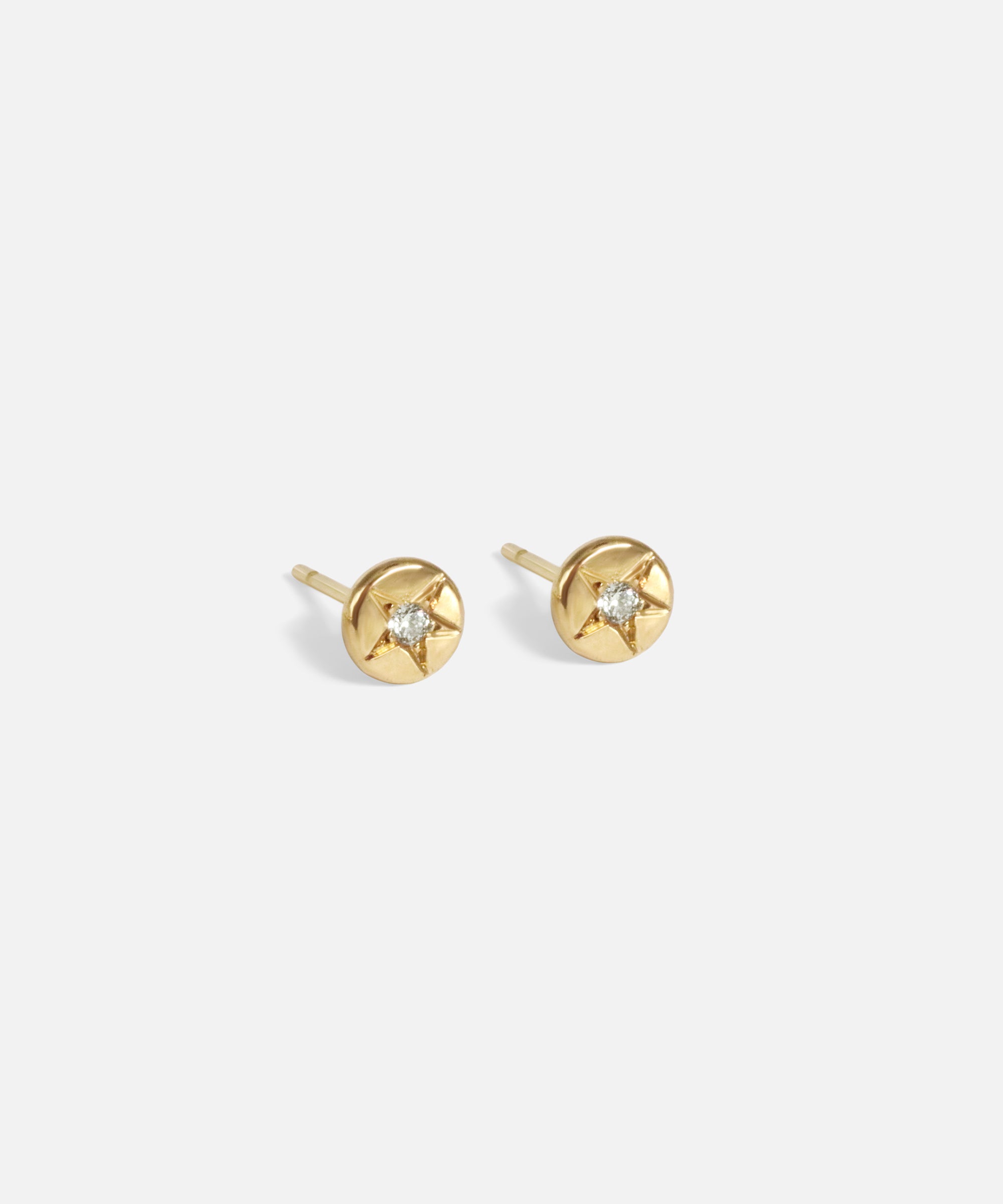 Side view of Star Set Diamond Disc Studs by Nishi