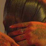 Model wears Ornata Ophidia Ring / White Diamond on ring finger alongside other items