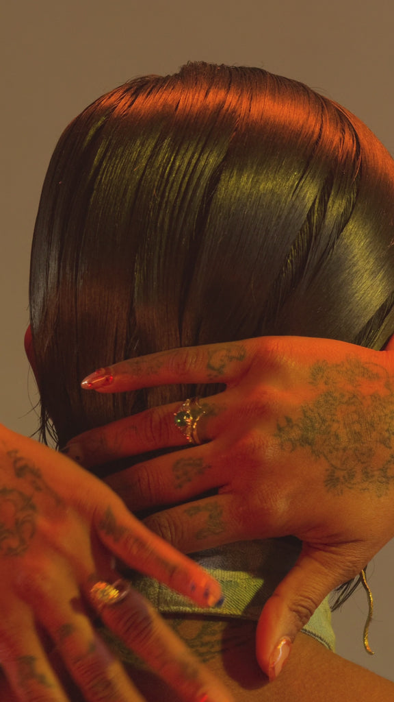 Model wears Ornata Ophidia Ring / White Diamond on ring finger alongside other items