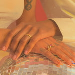 Models embracing hands showcasing favorite pieces from our collection