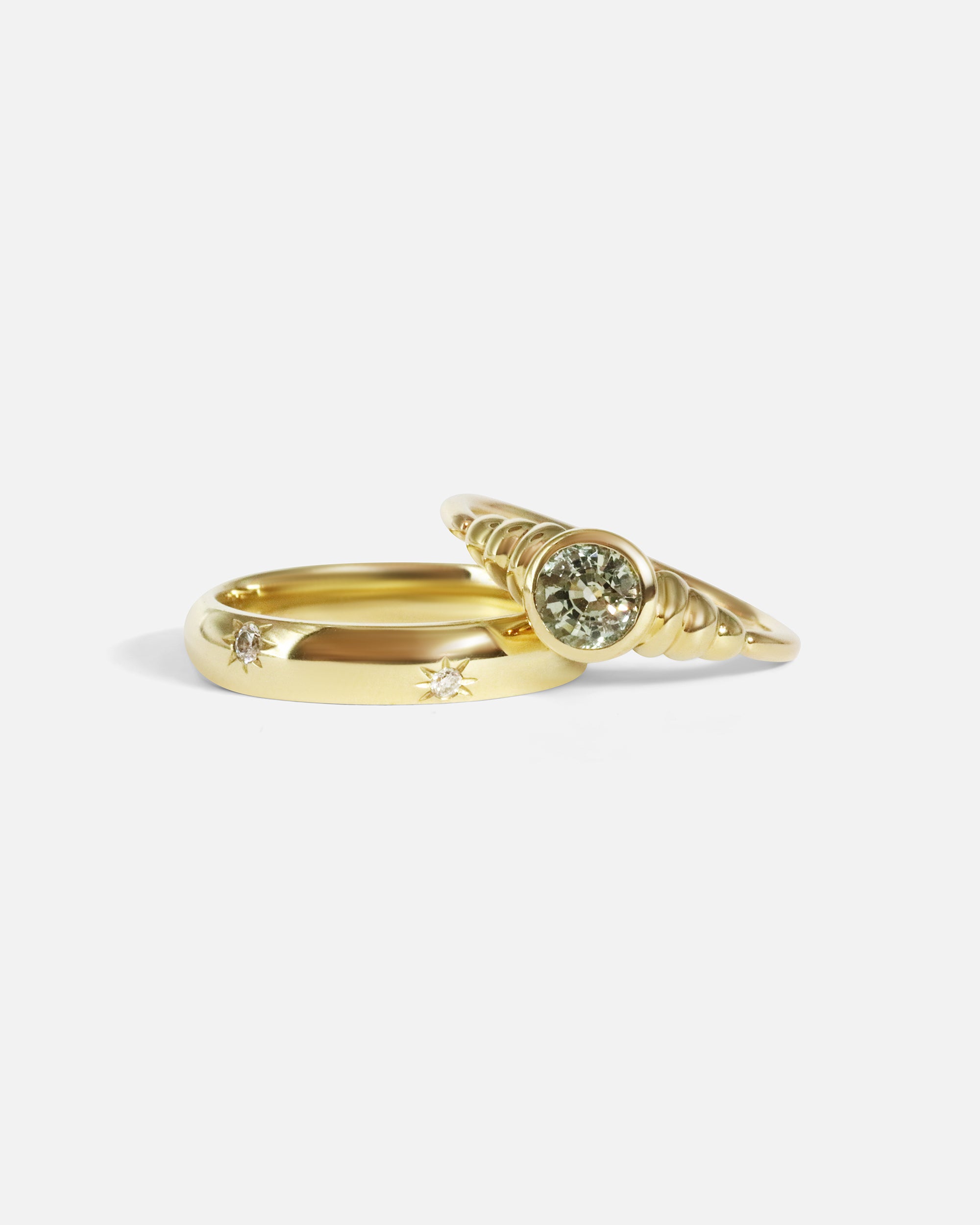 Stacked view of Hunny Ring in 14k yellow gold and Speckle Ring in 14k yellow gold by tmrw days
