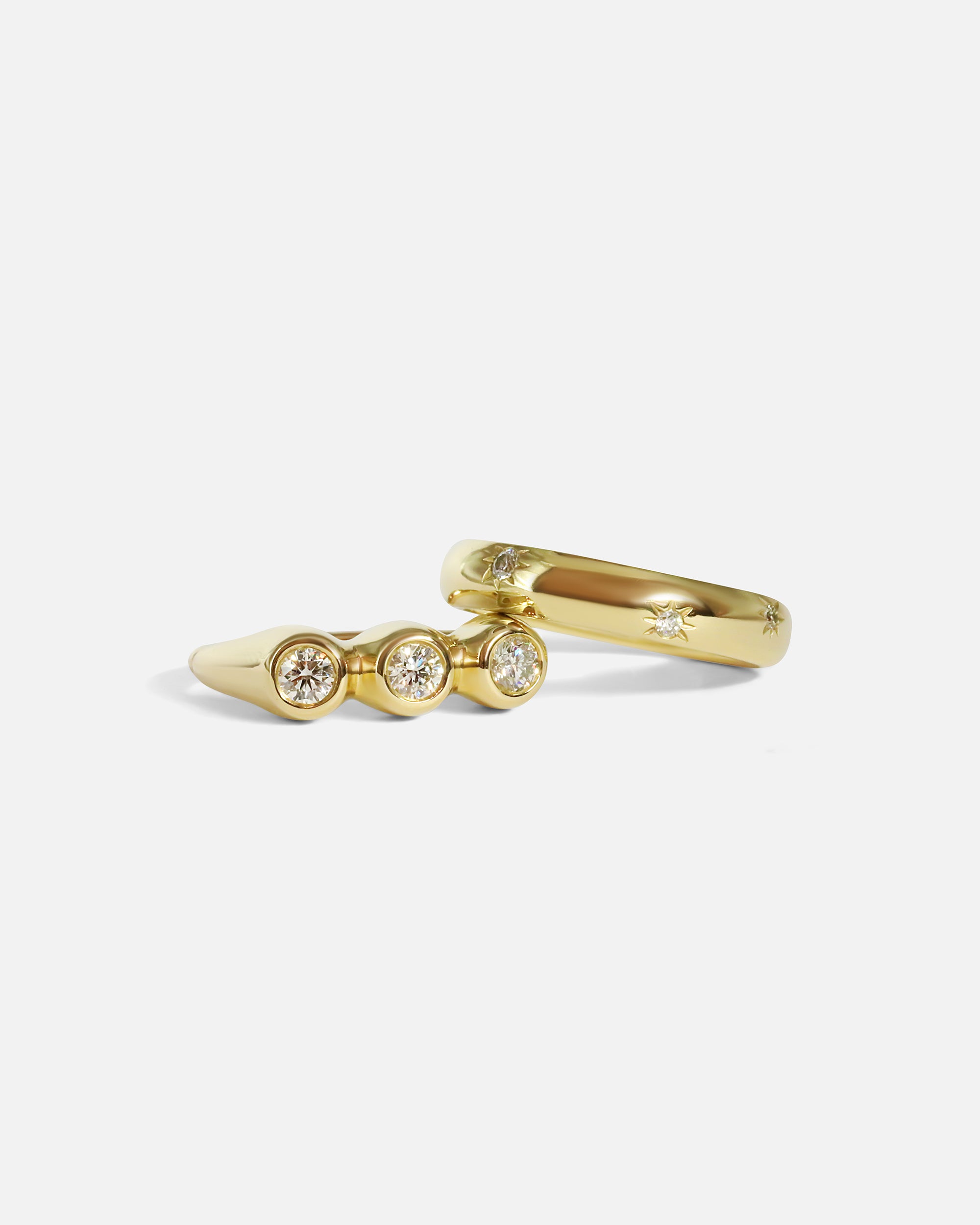 Stacked view of Belle Ring in 14k yellow gold and Speckle Ring in 14k yellow gold by tmrw days 