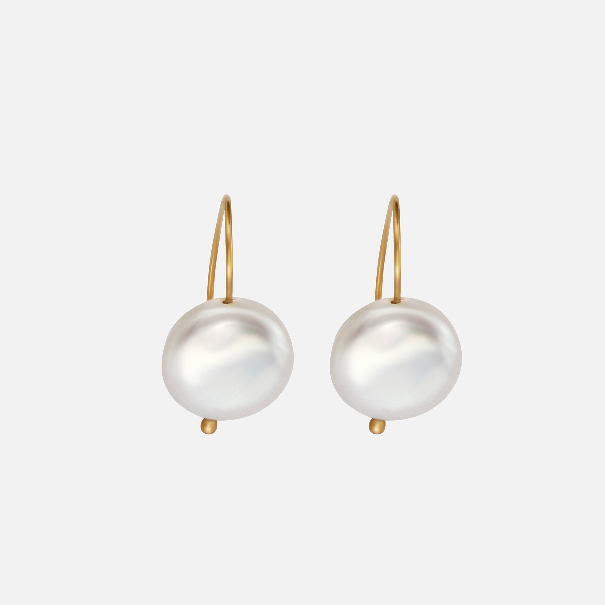 Front view of Button Pearl Earrings
