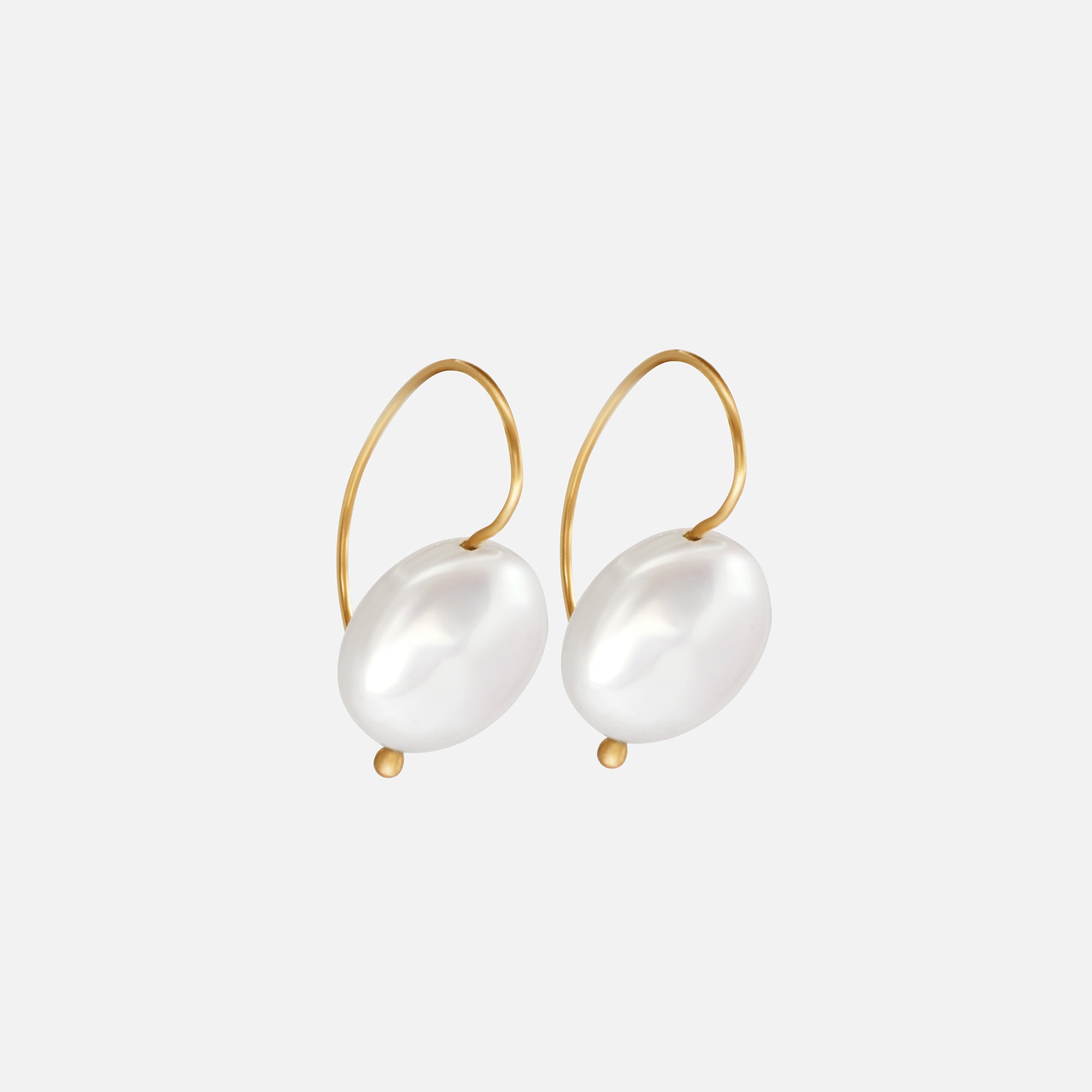 Side view of Button Pearl Earrings