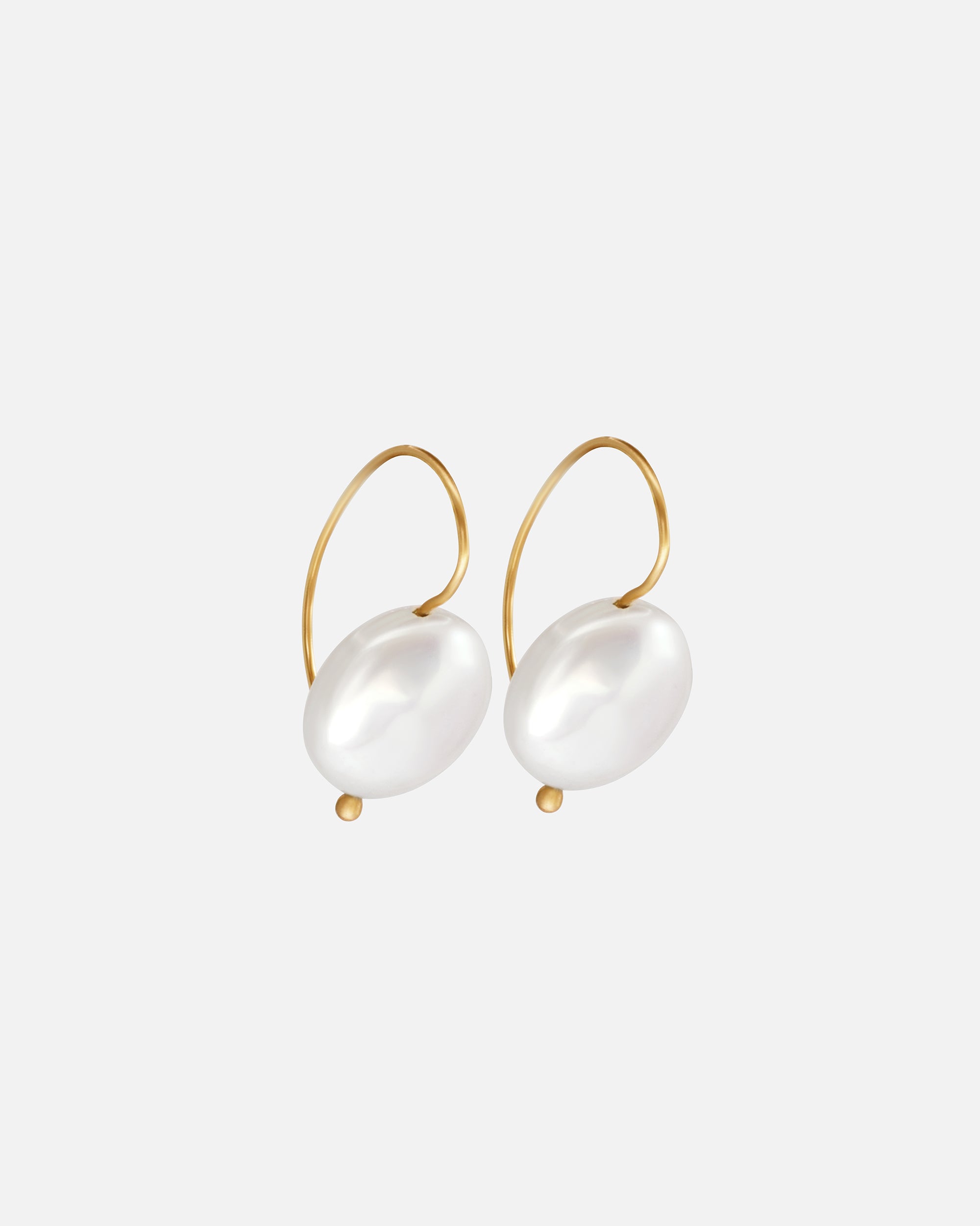 Side view of Button Pearl Earrings