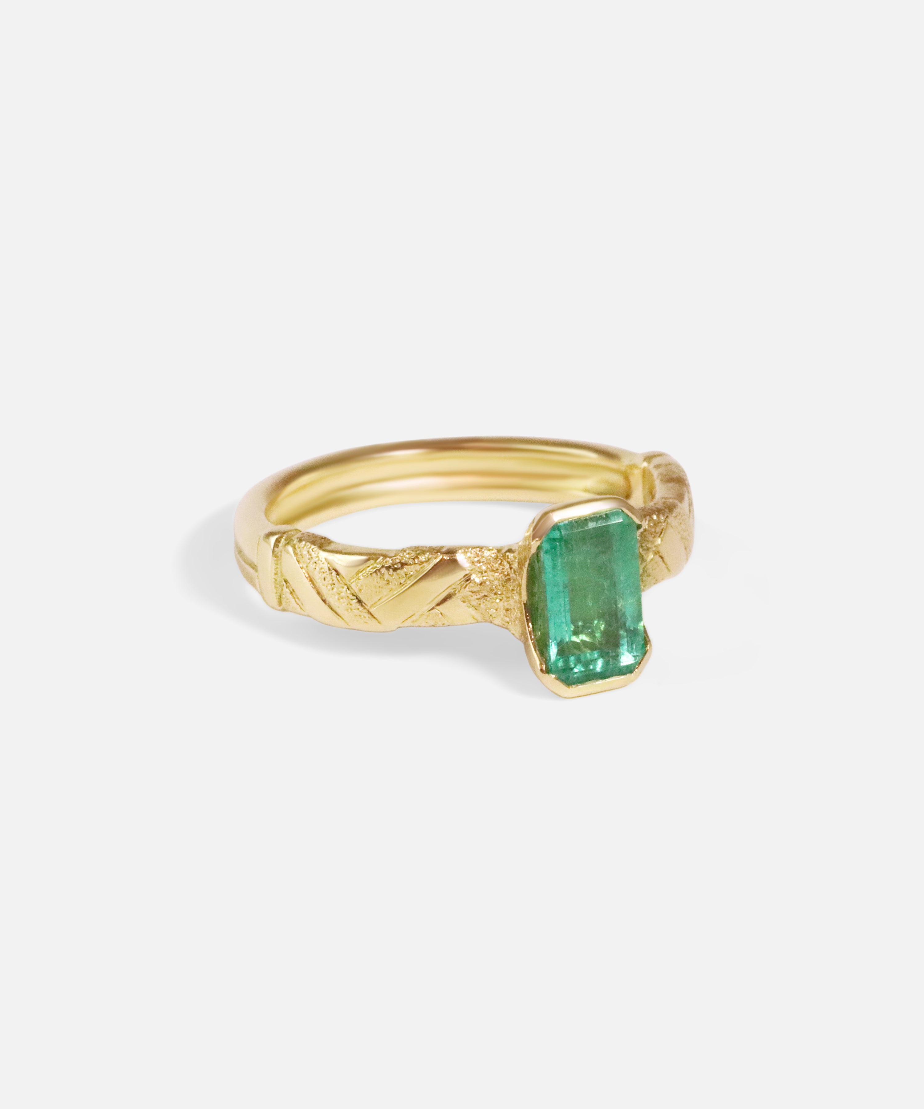 Angled side view of Paths / Columbian Emerald Ring by Young Sun Song