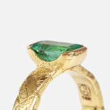 Close up angled side profile view of Paths / Columbian Emerald Ring by Young Sun Song