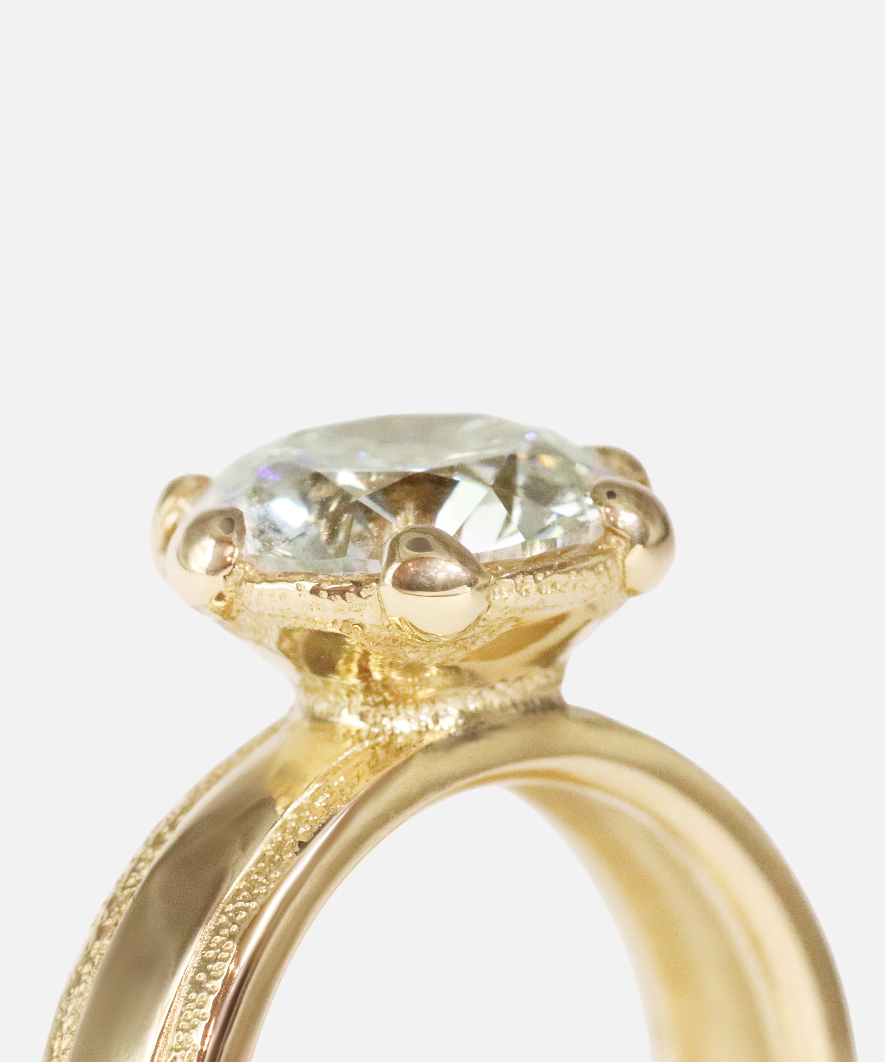 Close up agled side profile view of Parallel Band / Lab Round Brilliant Diamond by Young Sun Song