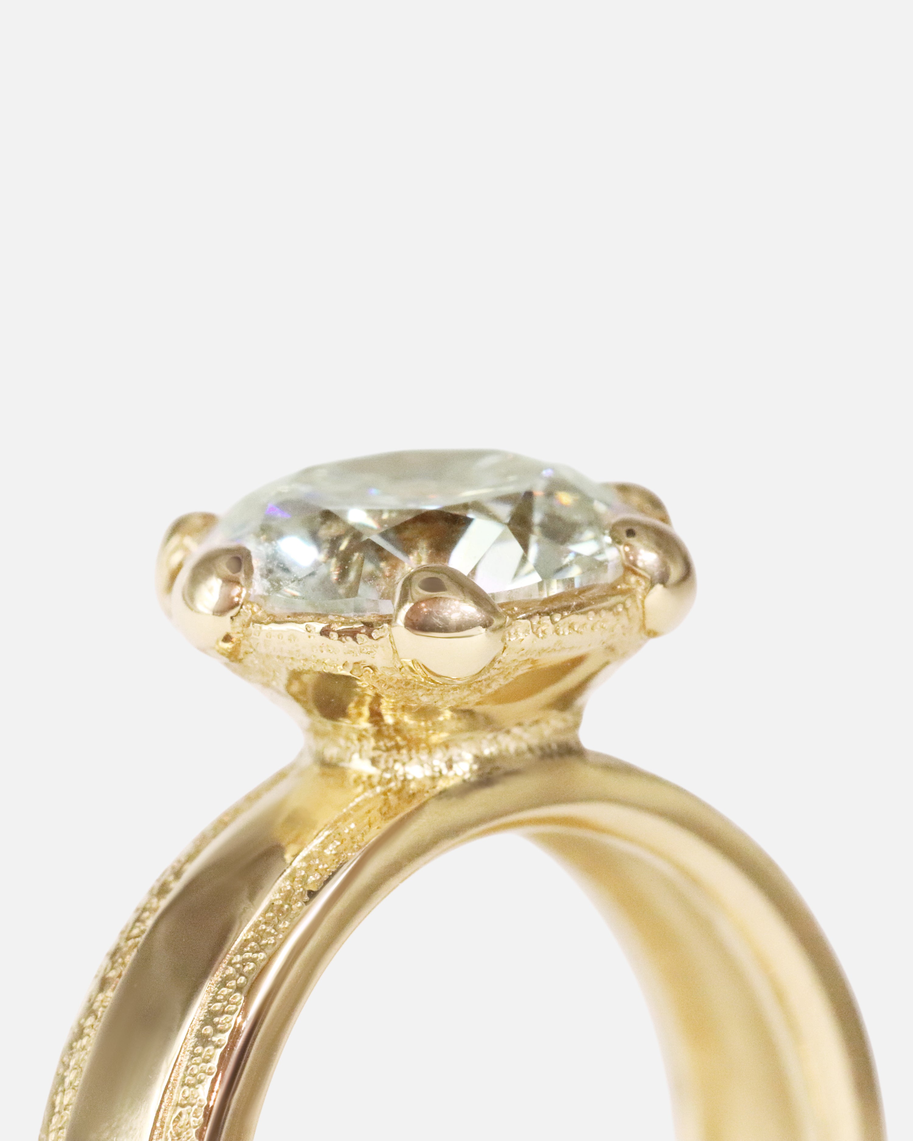 Close up agled side profile view of Parallel Band / Lab Round Brilliant Diamond by Young Sun Song