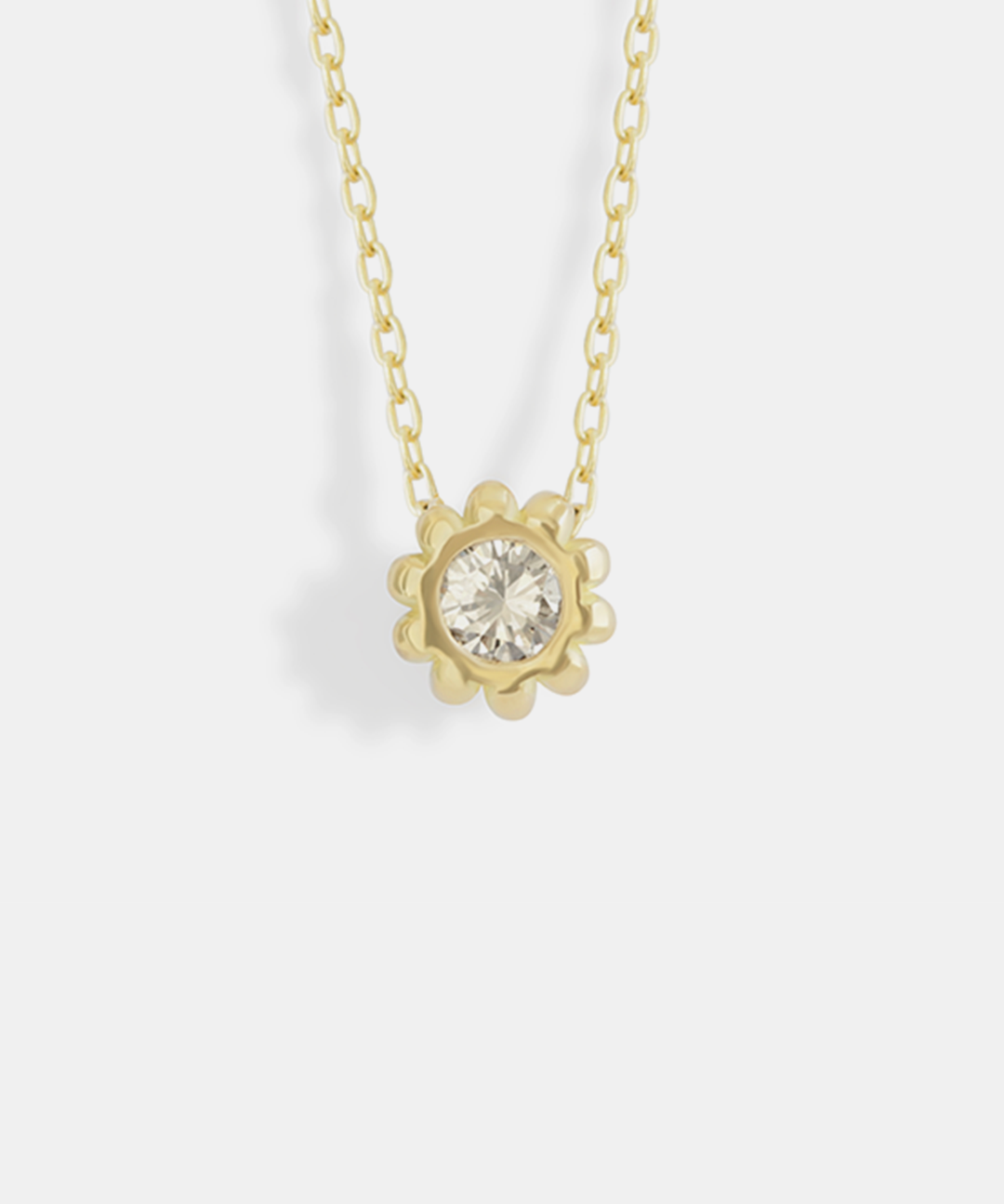 Front view of Skull Pass Thru Pendant in 18k yellow gold