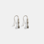 Side view of Skull Double Drop	Earrings in 18k white gold