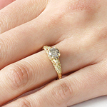 Model wears Skull and Flower Halo / Grey Diamond on ring finger