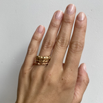 Model wears Rough Water Band in various widths on ring finger By O