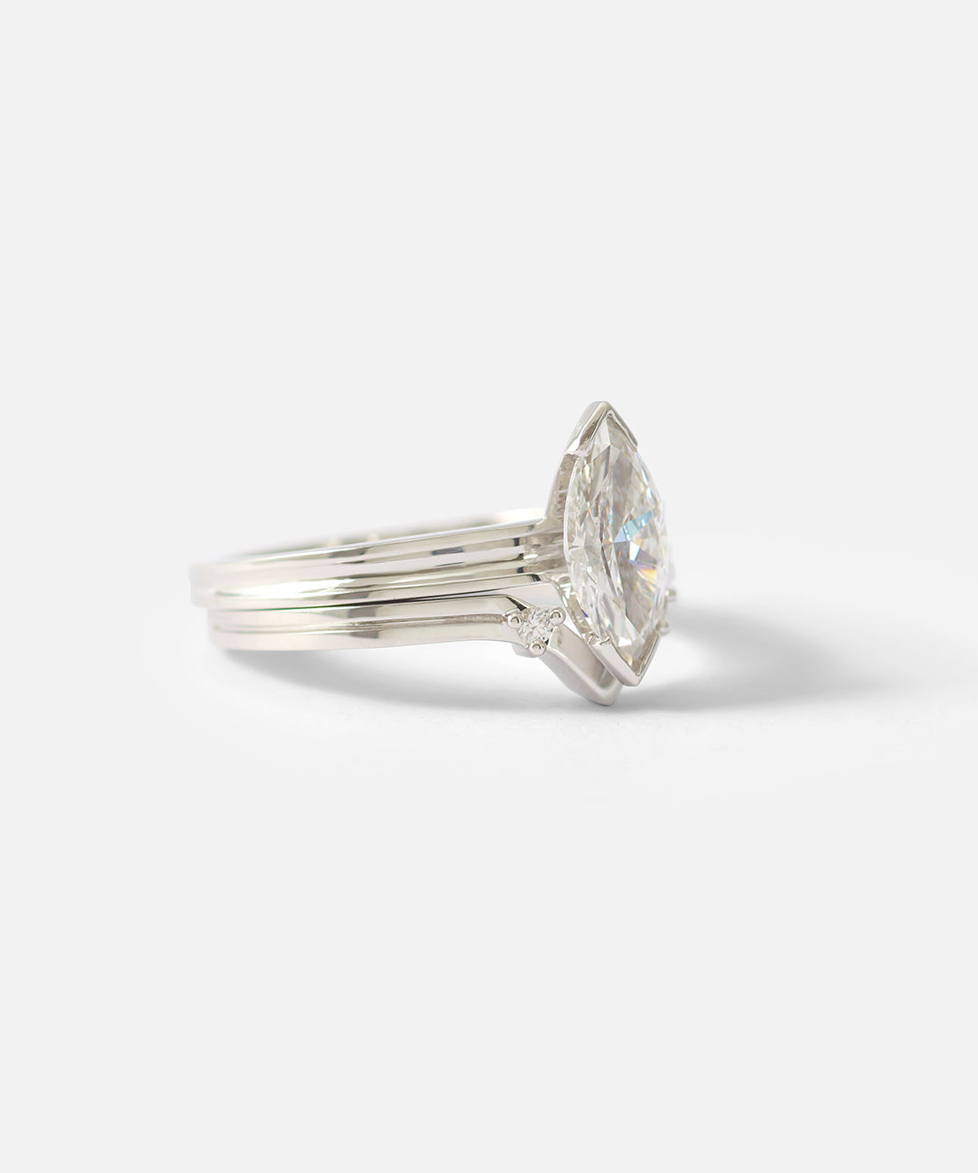 Stacked side view of Canal / Curved 2 Stone Ring by Ruoria in Platinum with an engagement ring