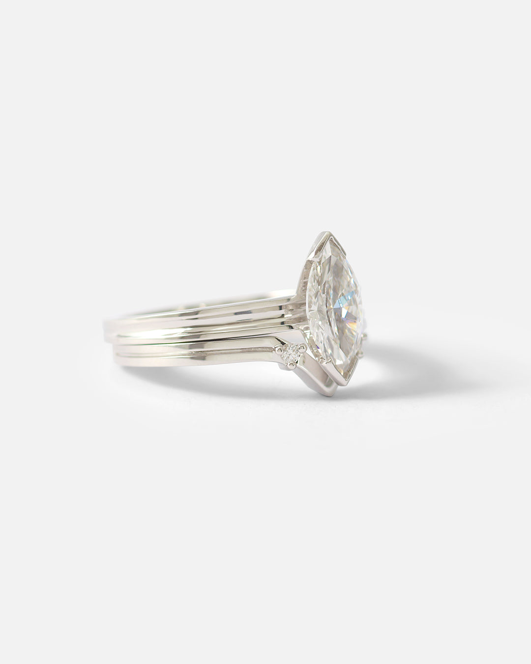 Stacked side view of Canal / Curved 2 Stone Ring by Ruoria in Platinum with an engagement ring