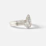 Stacked side view of Canal / Curved 2 Stone Ring by Ruoria in Platinum with an engagement ring